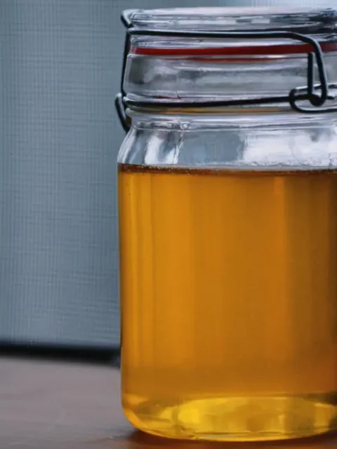 Ghee made at home and stored in a clear bottle.