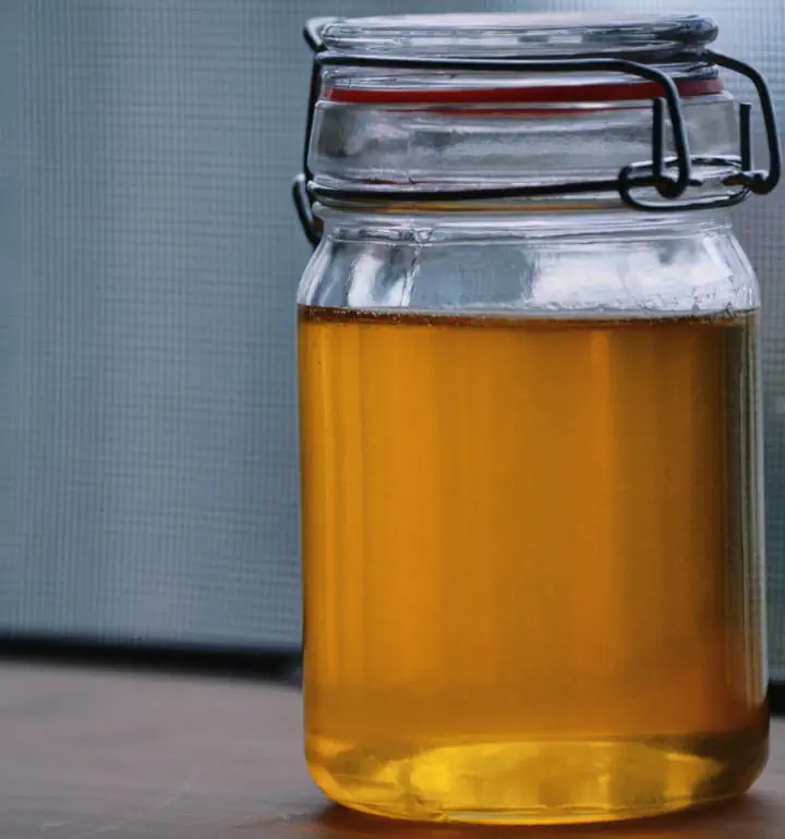 Ghee made at home and stored in a clear bottle.